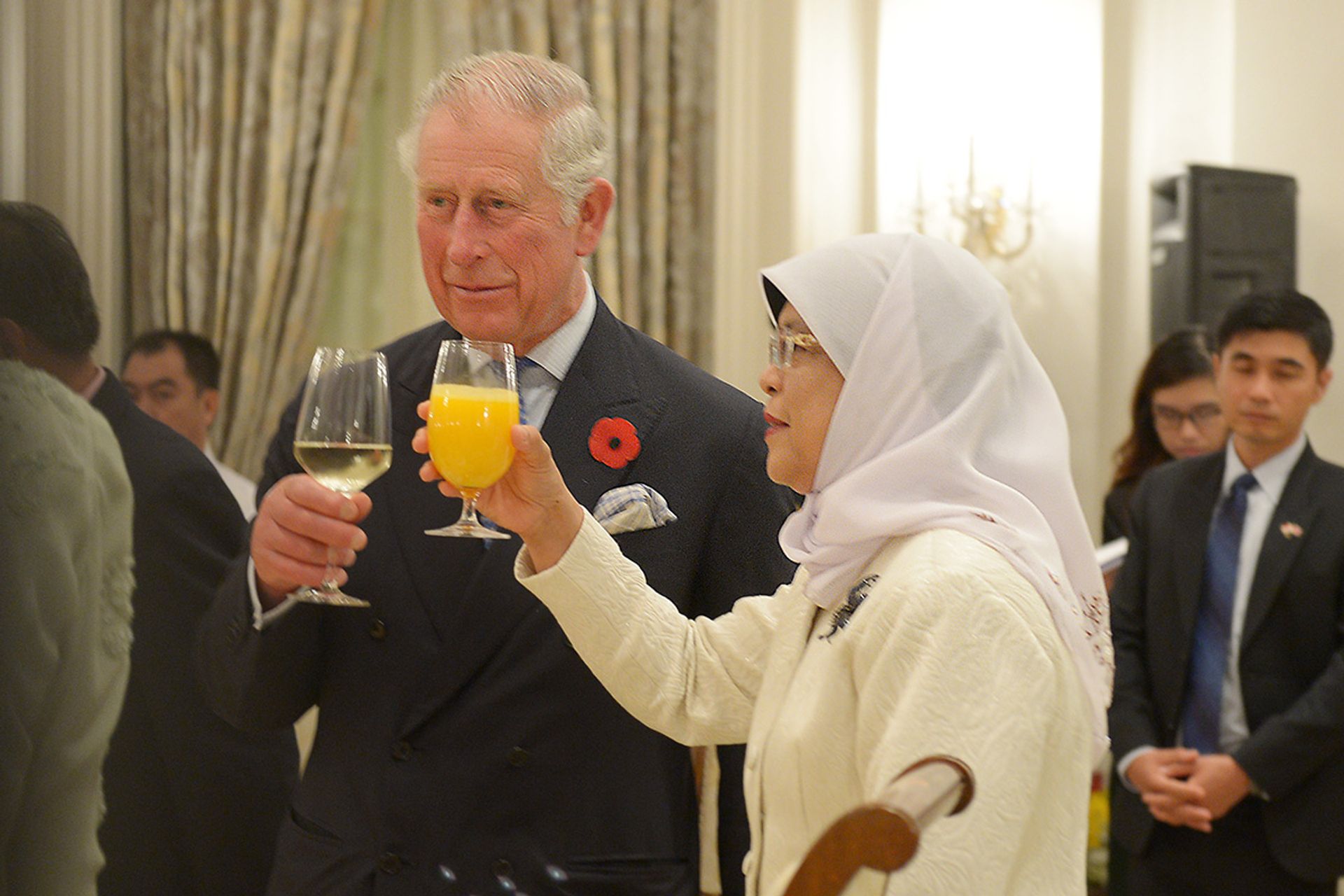 Britain’s then Prince Charles and President Halimah Yacob raising their glasses in a toast during a dinner that she hosted for the Prince and his wife Camilla, who was then the Duchess of Cornwall, at the Istana on Oct 31, 2017. The royal couple, who are now Britain’s King and Queen, were in Singapore as part of their Commonwealth tour, before the 25th Commonwealth Heads of Government Meeting in London. ST PHOTO: ALPHONSUS CHERN
