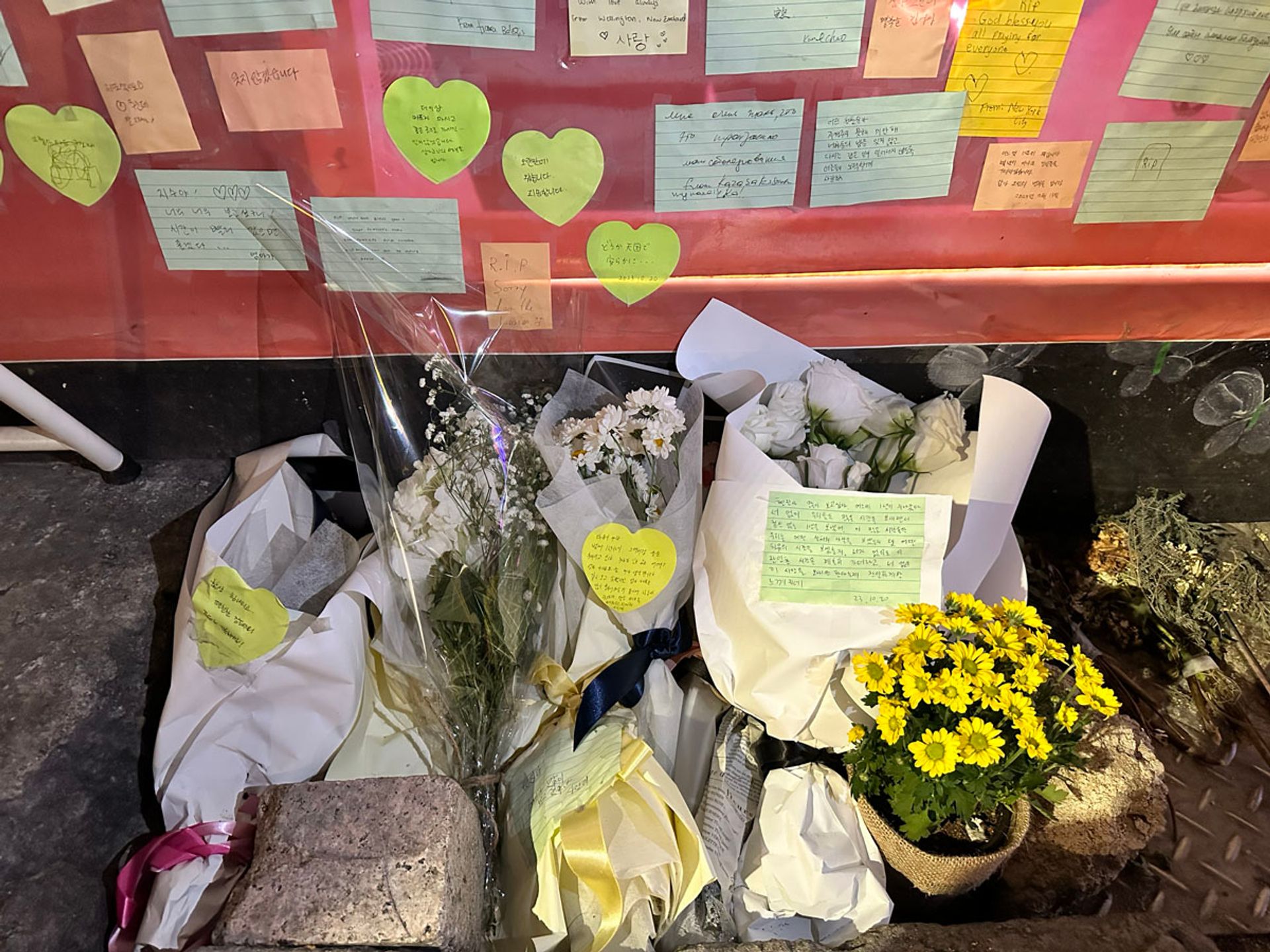 Flowers are placed at the bottom of the memorial wall dedicated to the victims of the crowd crush. They are left by visitors who came to pay respects, ahead of the first anniversary of the accident. PHOTO: WENDY TEO