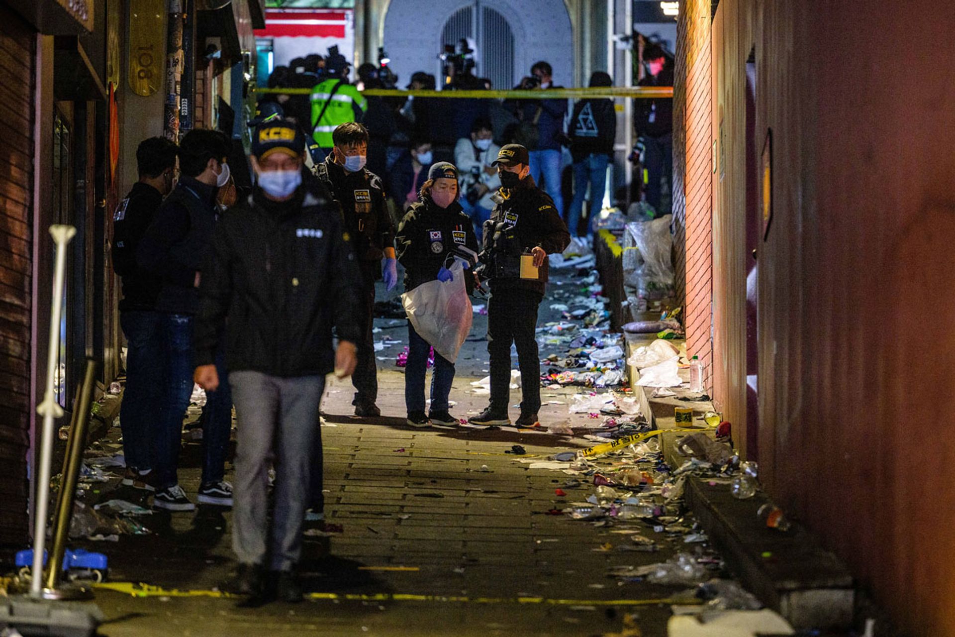 Police crime scene investigators inspecting the alleyway that was the scene of  the Halloween crush that left 159 people dead in 2022 in Seoul. PHOTO: AFP