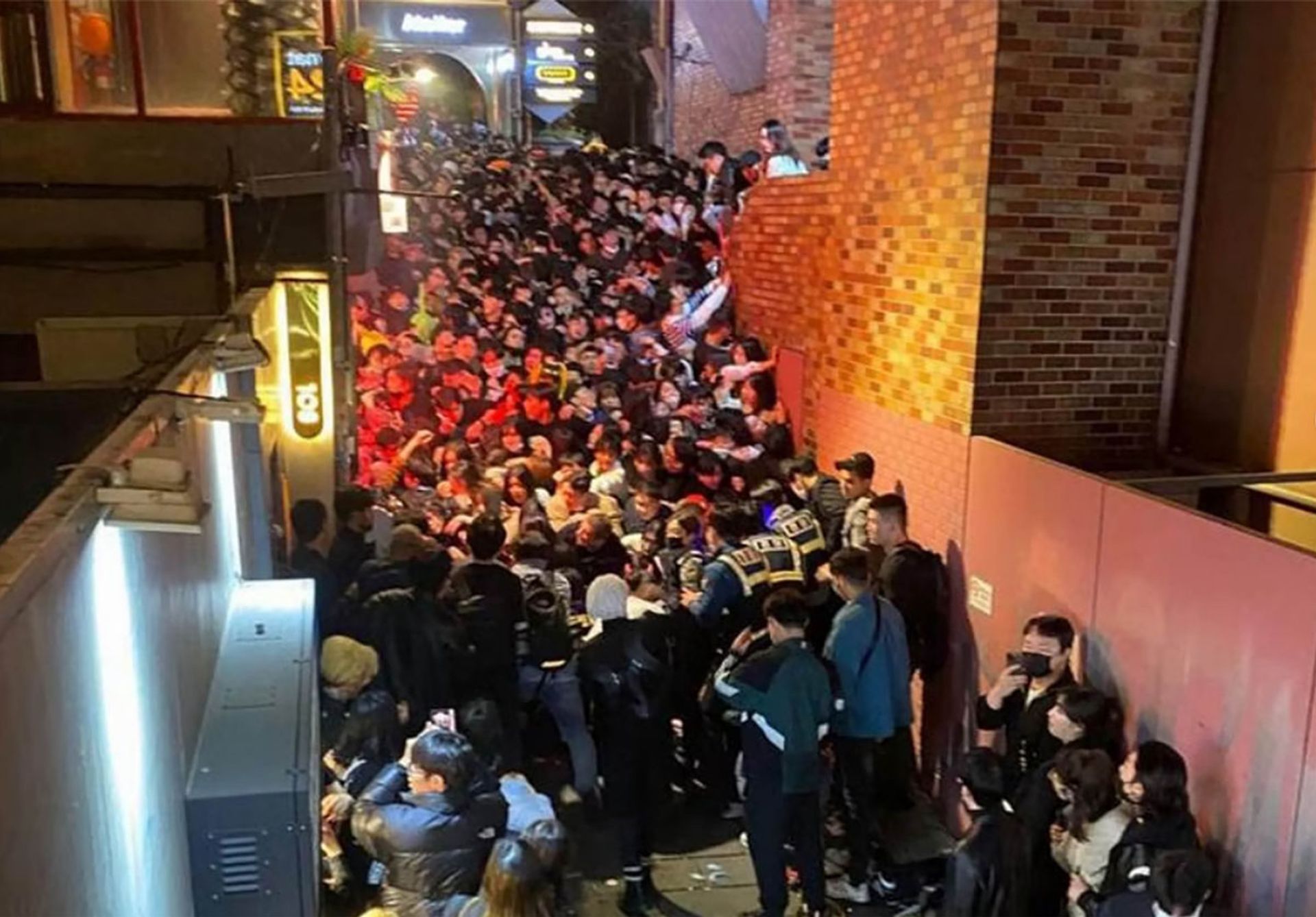 Hundreds of Halloween partygoers were stuck on the night of Oct 29, 2022, in this 40m-long, 4m-wide alleyway when surging crowds caused some to fall and triggered a domino effect. This photo is provided by a Singaporean who got caught but managed to make it out safely with some cuts. PHOTO: KOH MING EN